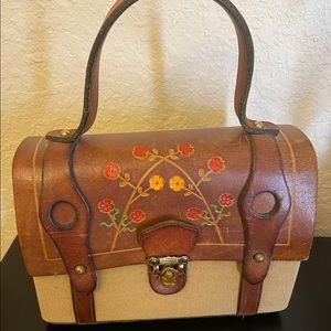 Vintage boho turn-lock Canvas and tooled leather handbag.